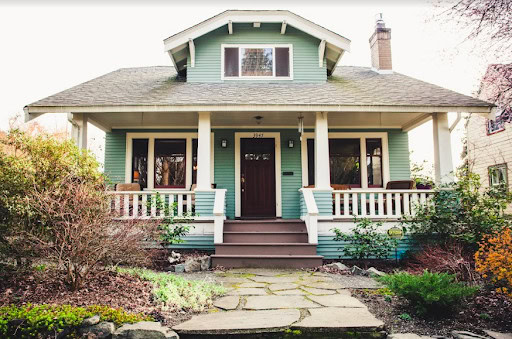 green house with wraparound porch